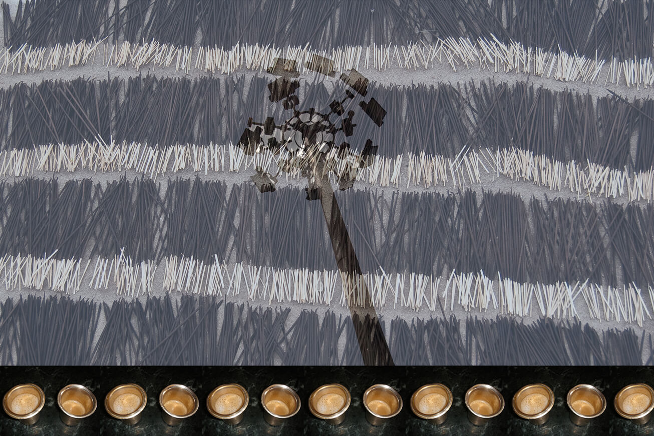 15cups with coffee spread below a big street light in the background of incense sticks.